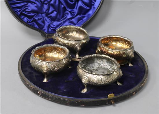 A matched set of four 18th century later embossed silver bun salts, in case with two associated spoons.